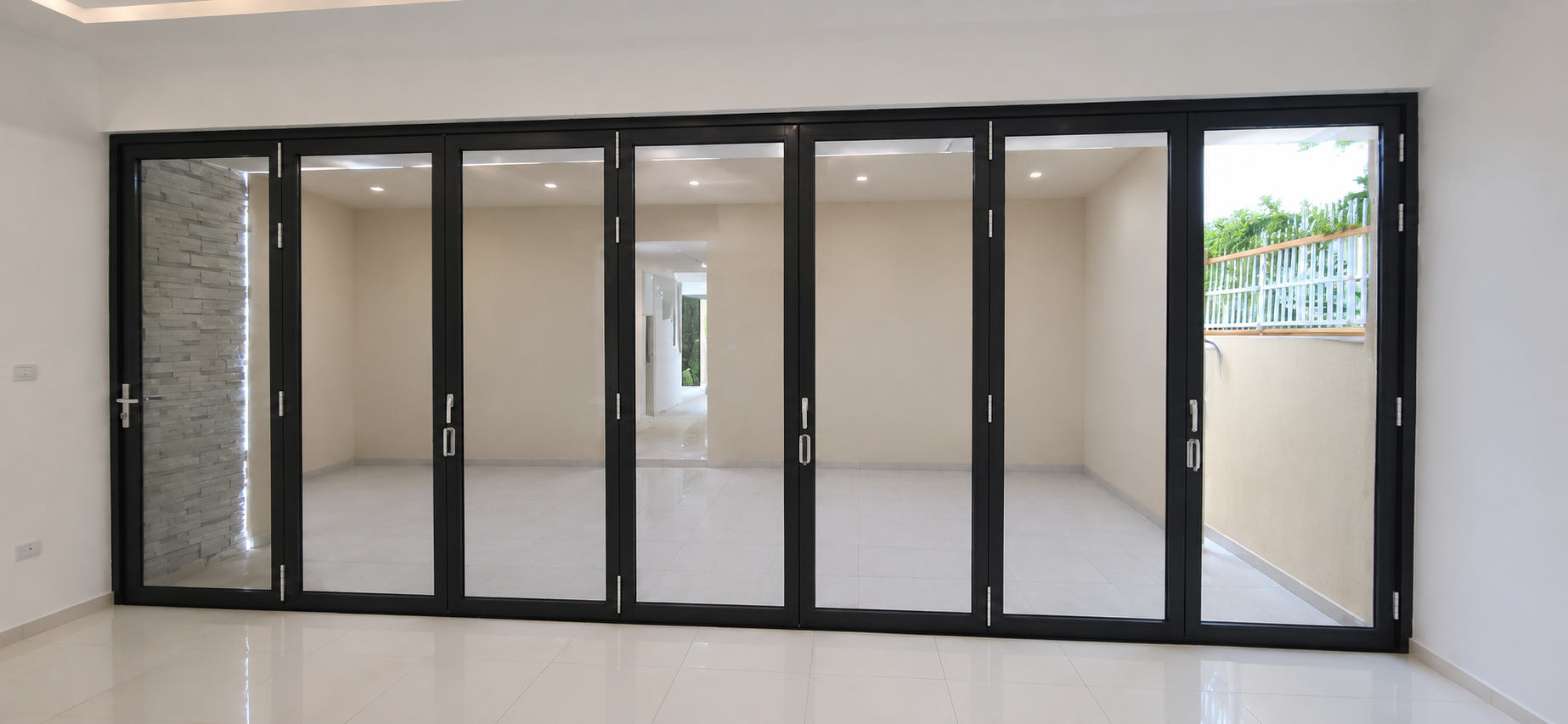 Bi-fold Doors — multi-panel aluminium and glass folding door by Alufab, Abu Dhabi