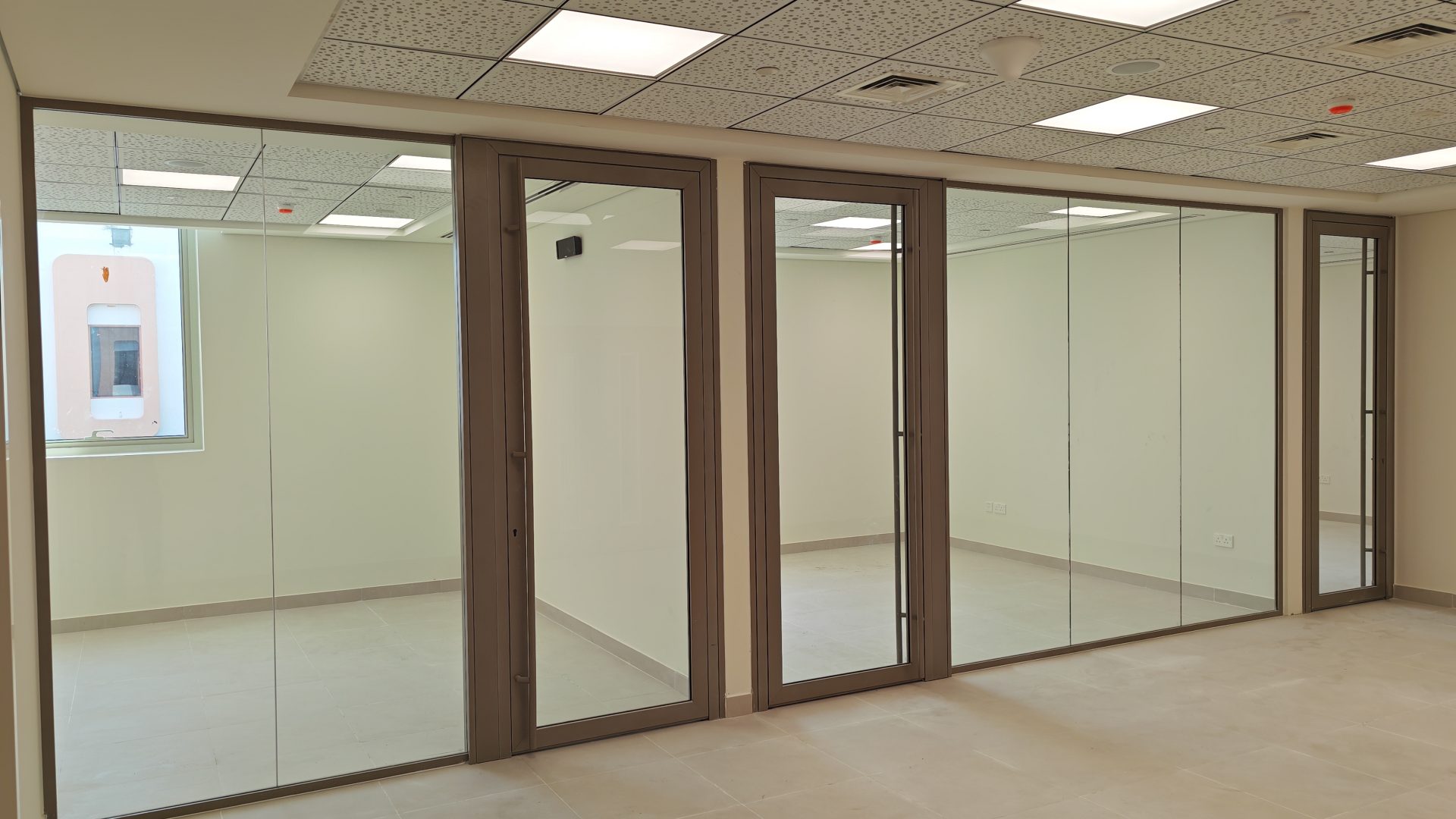 Office Partitions — aluminium-framed glass office partitions by Alufab, Abu Dhabi